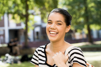 woman smiling on campus closeup